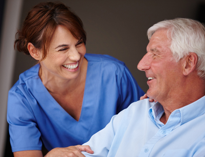 Photo of Nurse with happy SSC client after surgery